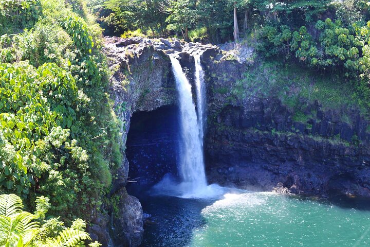 Tall waterfall with pool