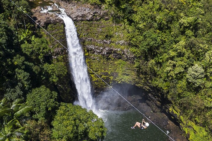 Ziplining past waterfall